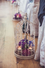 Chic-birdcage-aisle-decor-with-flowers-and-candles.jpg