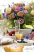 A-tutti-frutti-summer-wedding-table-with-mixed-roses-and-cor.jpg