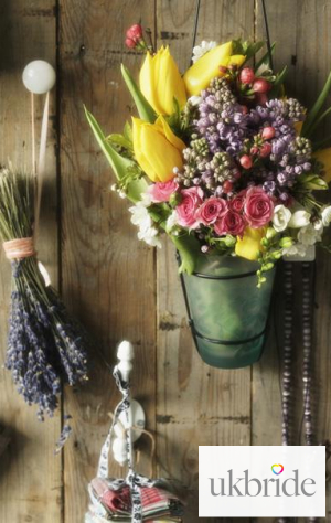 Small-vases-of-seasonal-flowers-make-cute,-country-style-pew.jpg