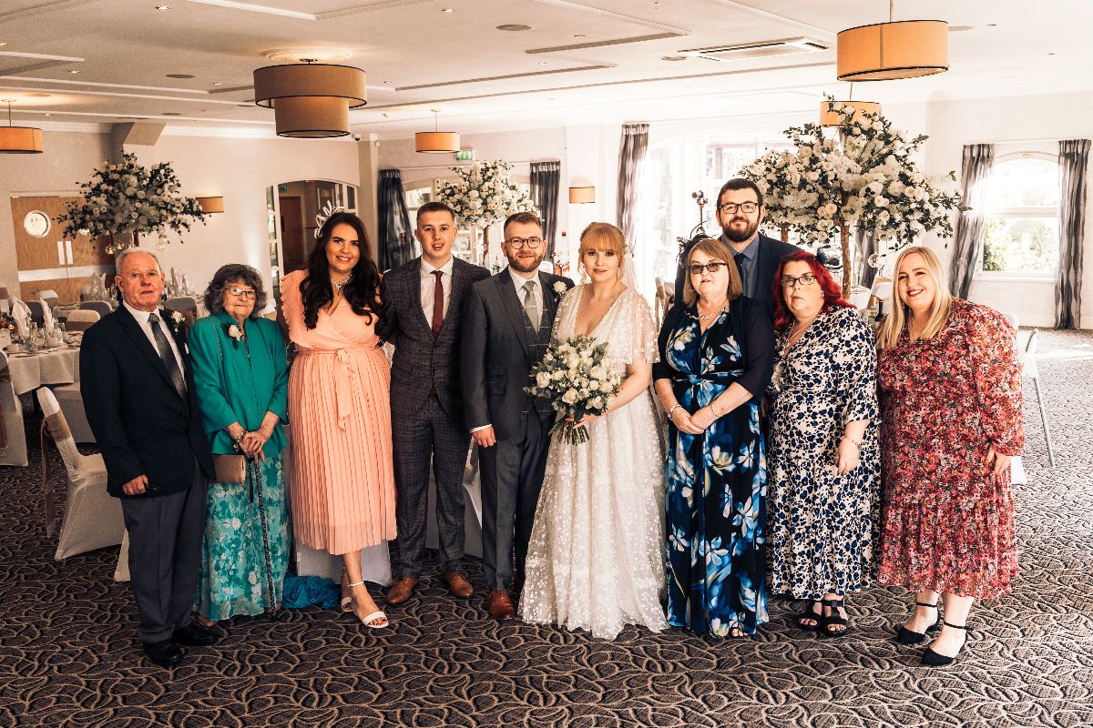 The family gather for photographs at Jessica and Rhys wedding which was hosted at Lion Quays Resort in Shropshire.