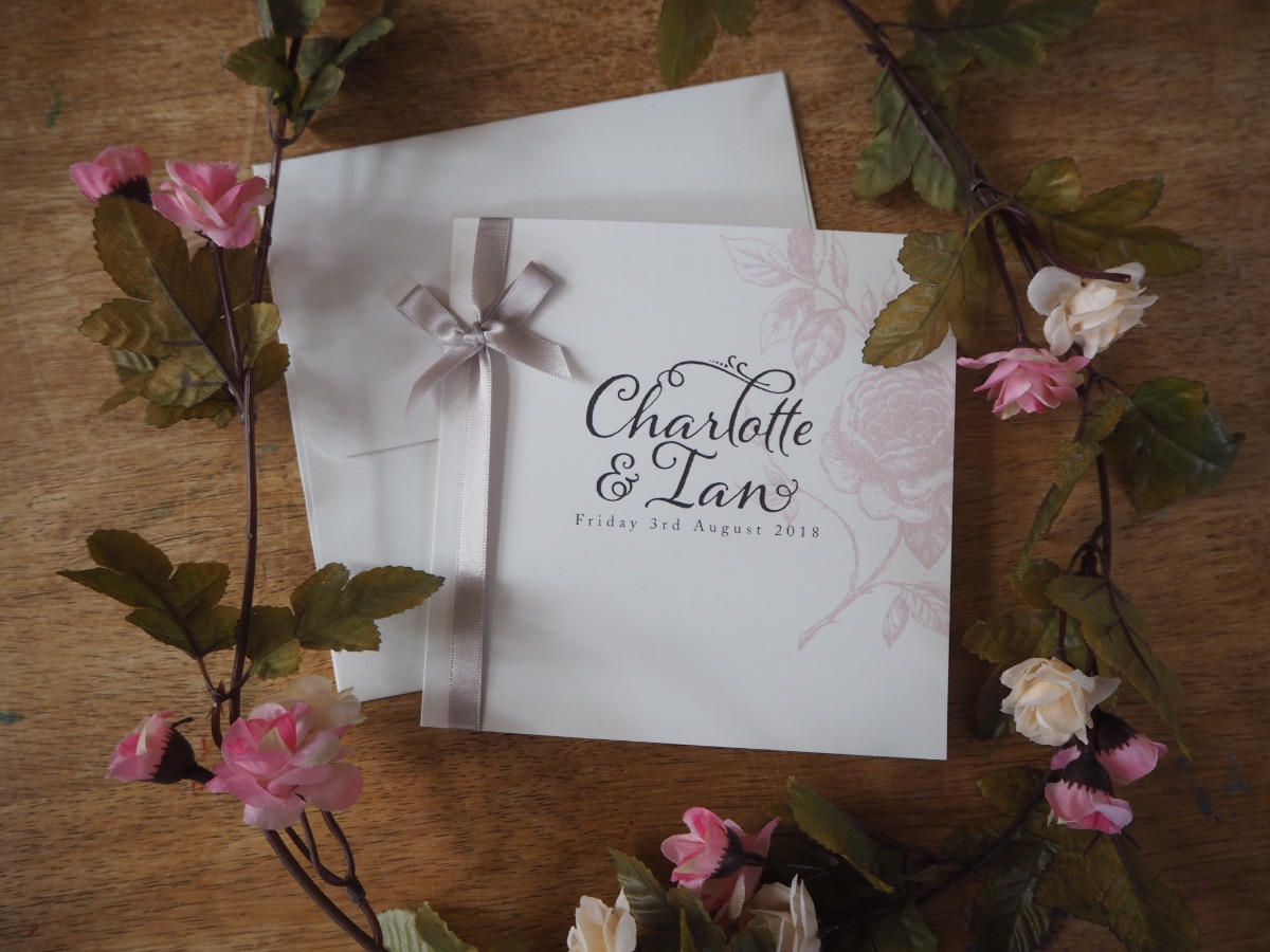 Vintage Rose 150mm square invitations in blush and charcoal with oyster satin ribbon