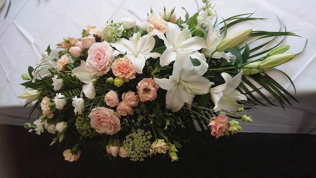 Top table flowers in pink and white, including lily, roses, stocks, carnations and eustoma