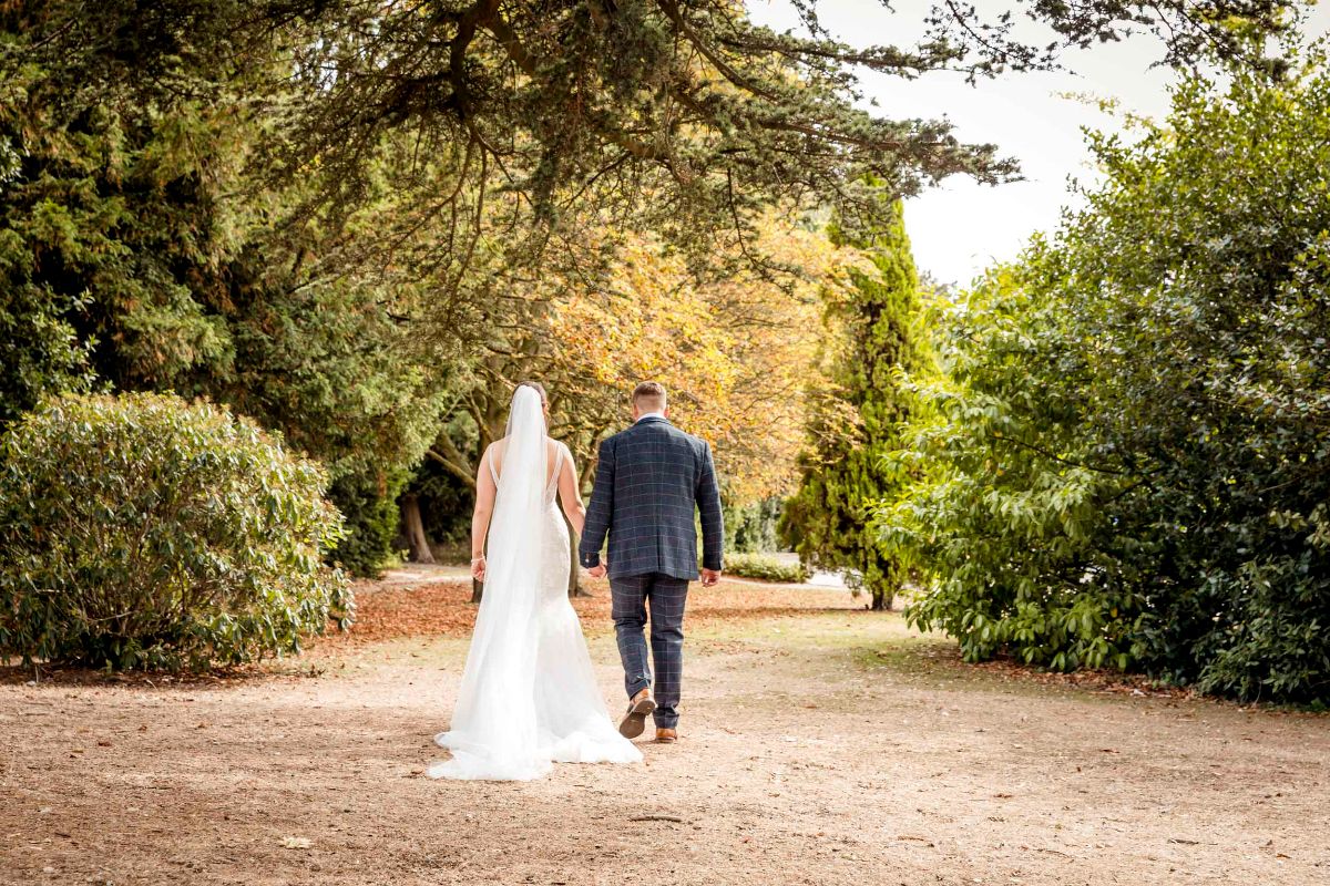 The Bride & Groom share a walk in the grounds of Glenfield Registry Office Leicester 