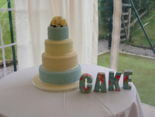Cake size and colour (pale blue) - 'dotted' pearled detailing on tier 2 & 4