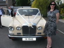 This was the groom and his familys car, best mans partner posing in front!