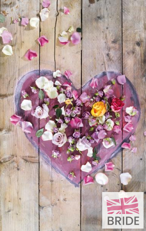 A-heart-shaped-decoration-strewn-with-rose-petals-makes-a-ch.jpg