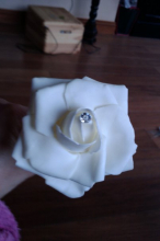 Open each rose by bending the petals back.
