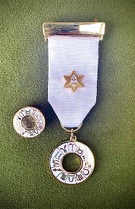Associate of the Inner Magic Circle with a Silver Star.