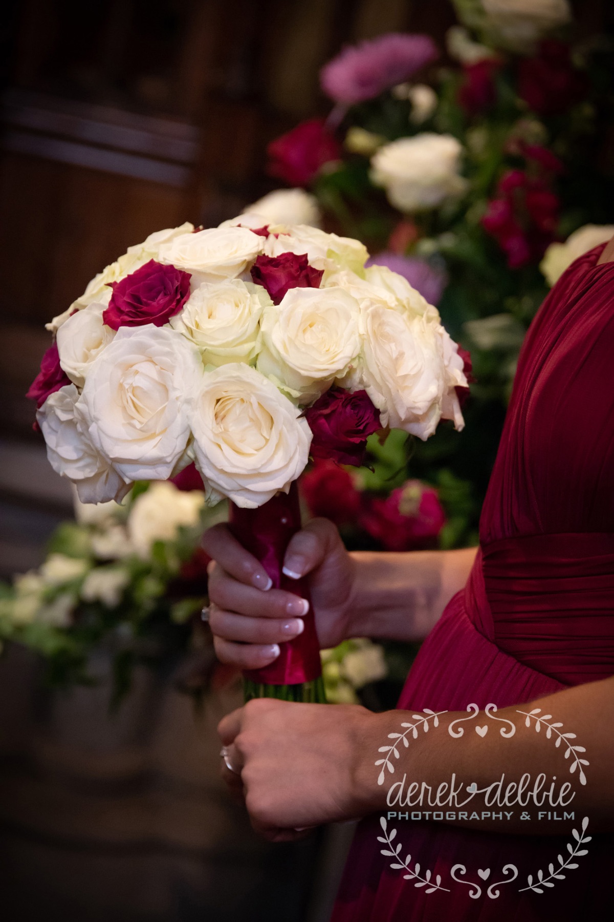 Bridesmaid holding bouquet during service
