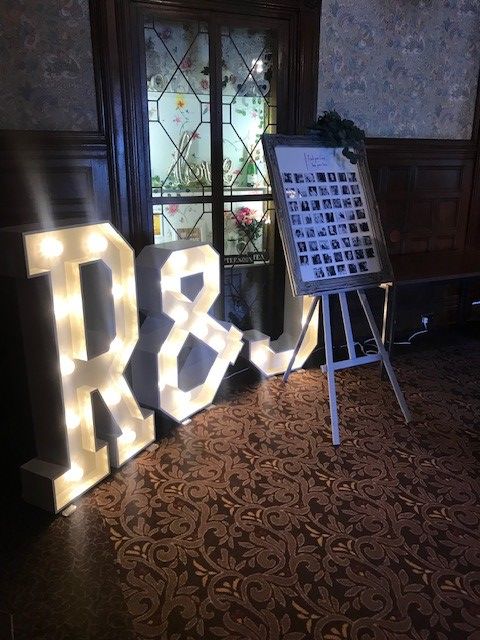 Light up letters representing the happy couple's first initials.