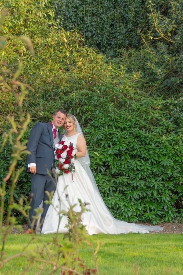 A lovely photo of the happy couple in our extensive grounds.