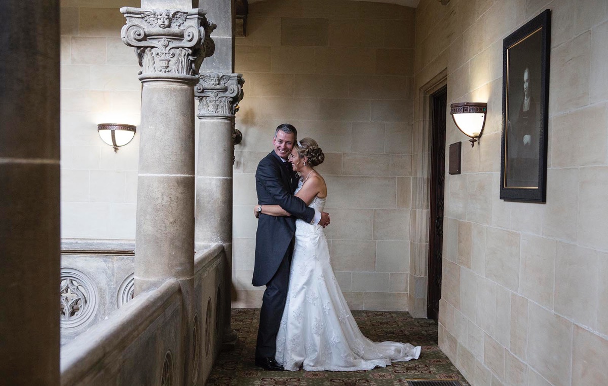 Bride and groom stealing a quiet moment in the gallery