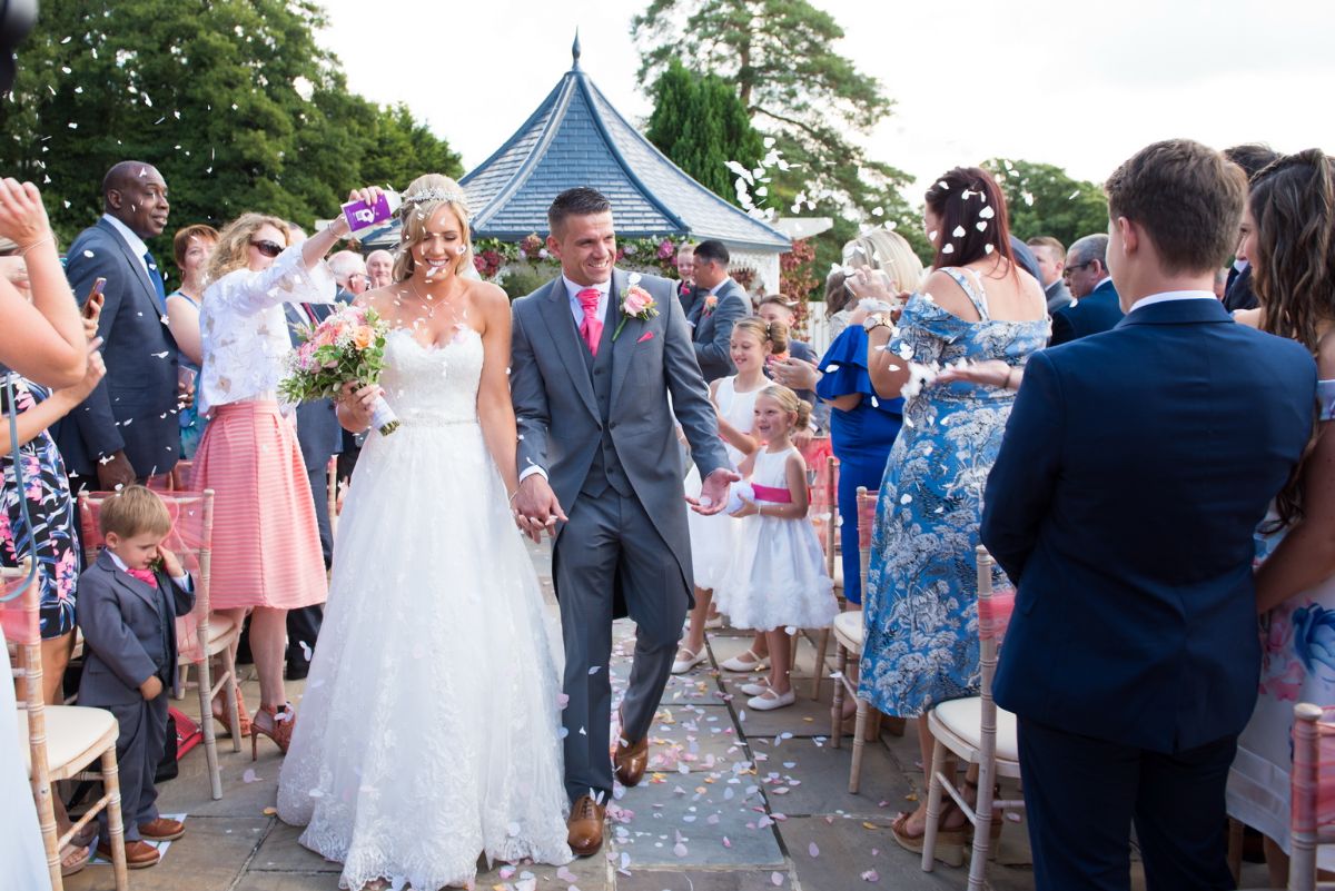 Confetti at Southdowns Manor in Hampshire Wedding Photographer - outside wedding venue