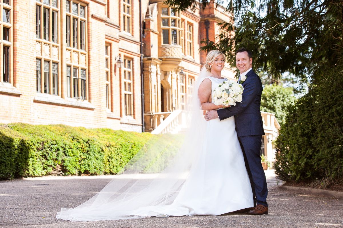 Bride and groom outside the mansion at Woldingham School, Marden Park