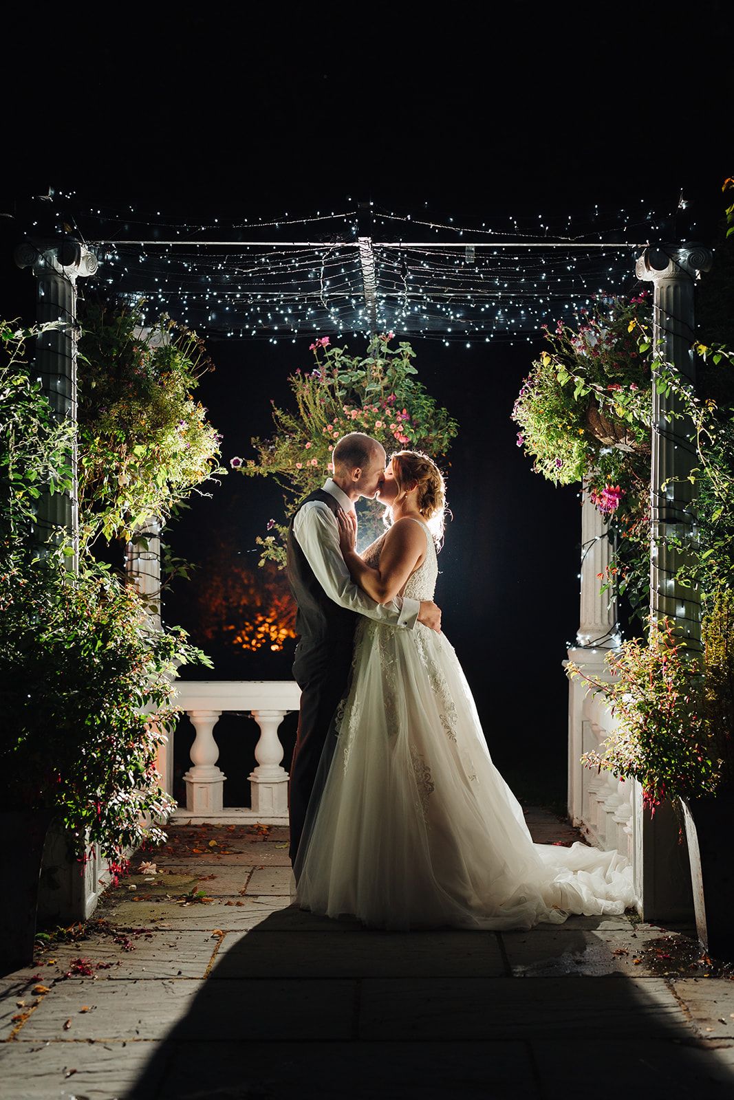 stunning shot under the fairy lit pergola