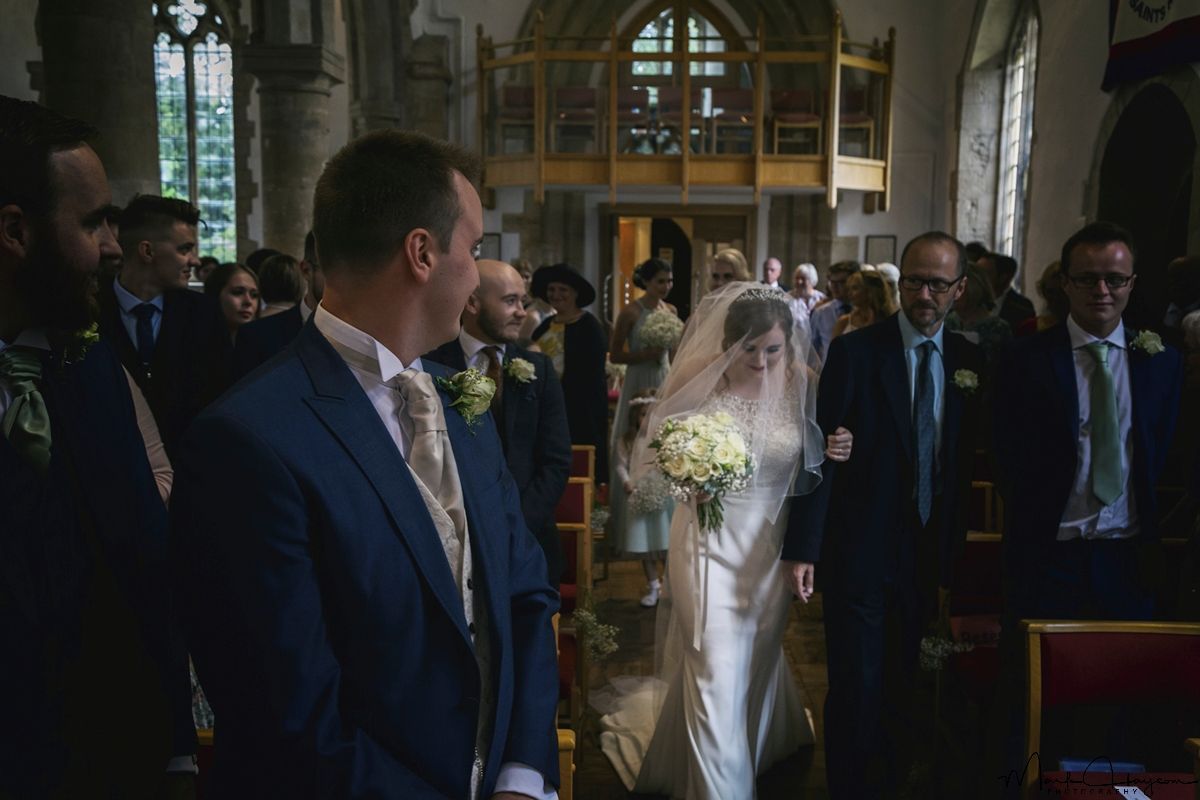 Vintage Look - Walking down the Isle the Grooms first glimpse.