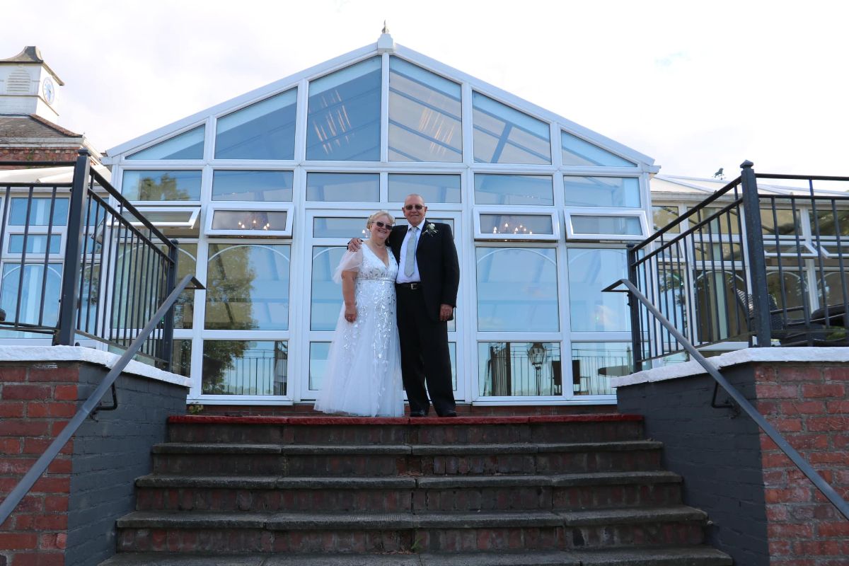 Molly and Bryan look out over the adjacent waterway after their ceremony at Lion Quays Resort in July.