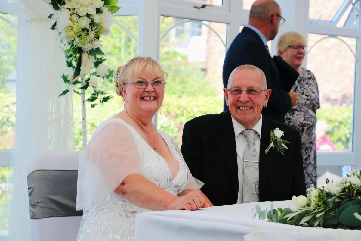 Molly and Bryan sign the register after their ceremony at their wedding at Lion Quays Resort in July. 