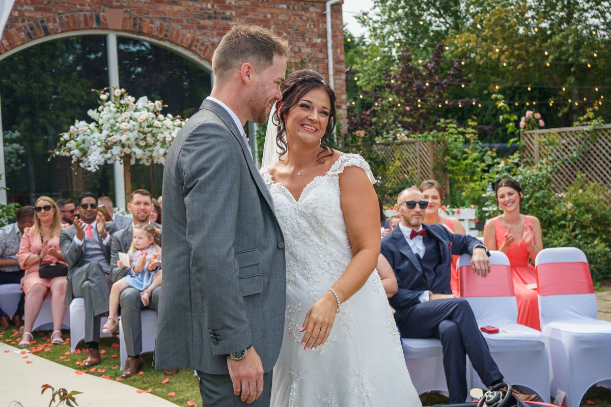 Jenna and Adam choose a summer wedding to take full advantage of the outdoor ceremony to celebrate their wedding day at Lion Quays Resort in Shropshire.