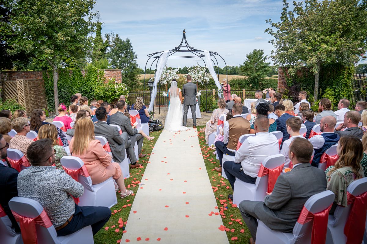 The guests gather to witness Jenna and Adam celebrate their wedding day at Lion Quays Resort in Shropshire.