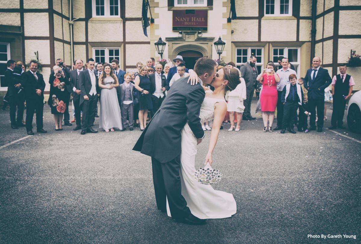 Teisha and Craig share a kiss in front of their family and friends at the Lyons Nant Hall Hotel