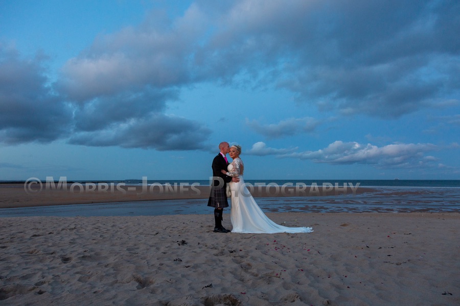 The beautiful blue hour on the beach at sundown.