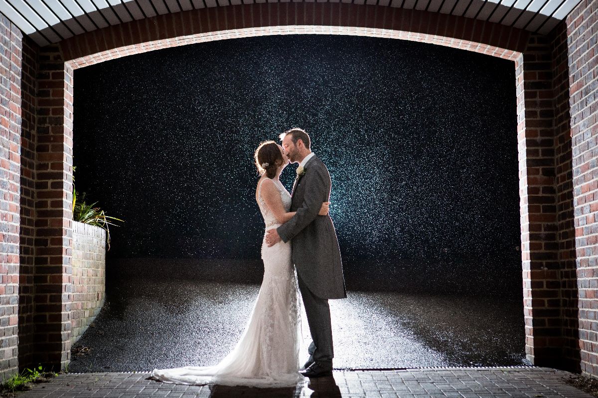 Bride and Groom in the rain 