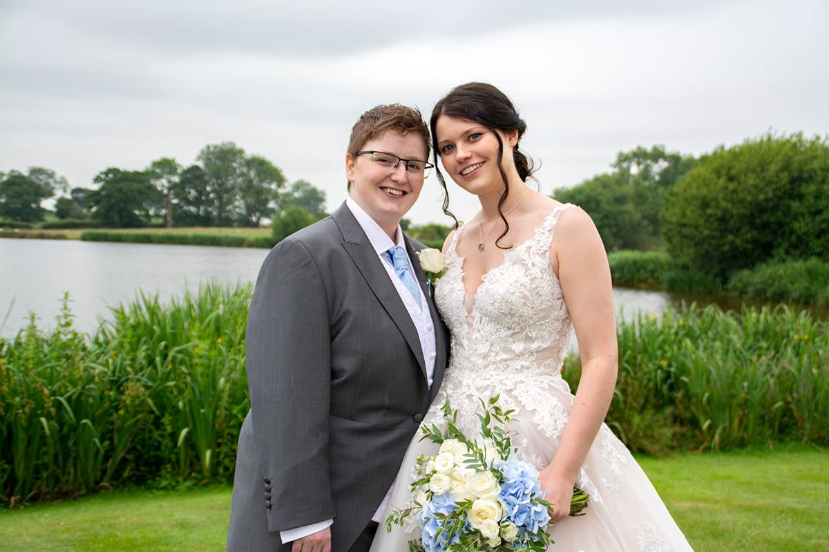 Bridal couple by pond