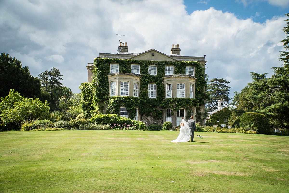 Bride & Groom walking up towards Northbrook Park