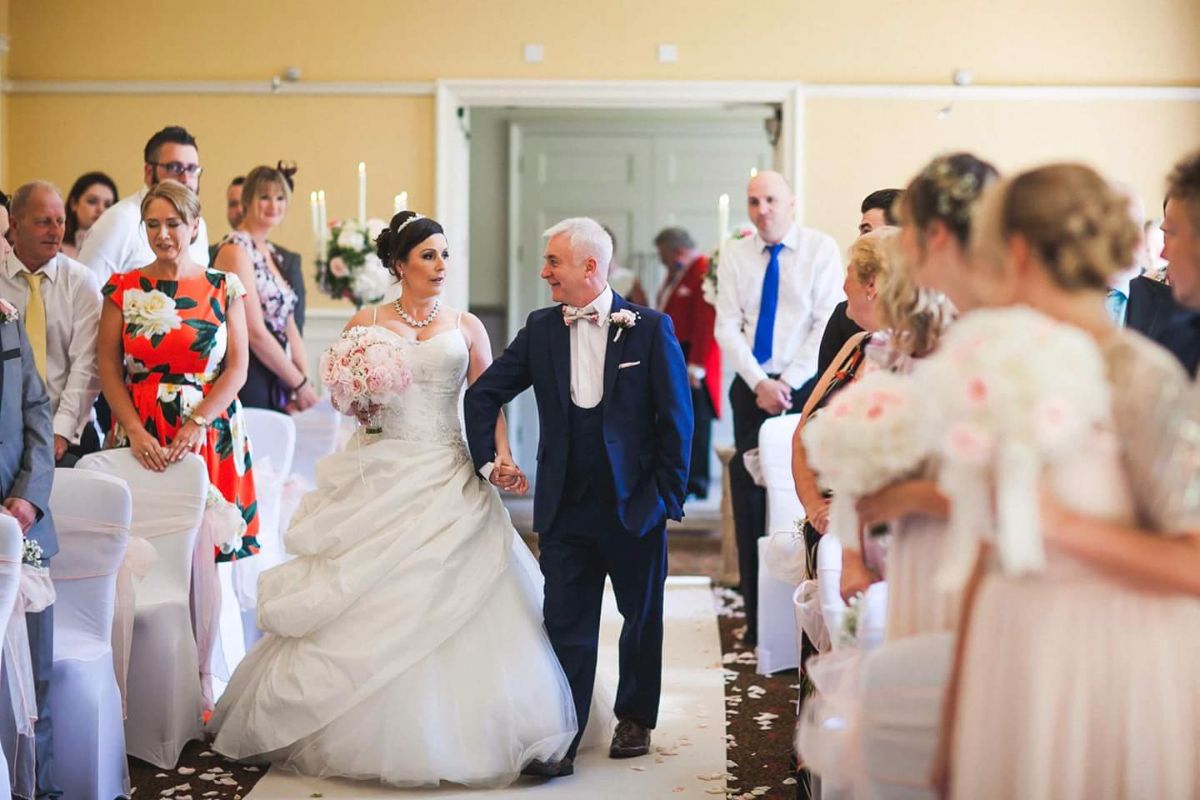 The walk down the aisle... accompanied by my uncle as my dad is no longer with us... bitter-sweet.. I had a bouquet charm with his picture in...