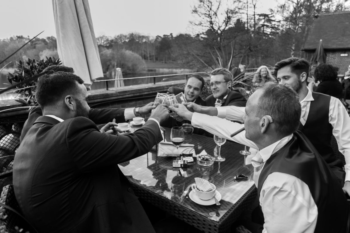 Male bondng time with cigars and drinks