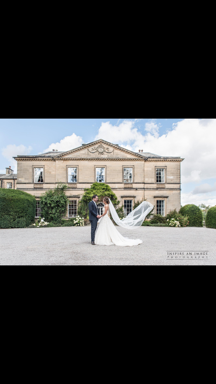 Myself and my new husband Nic, outside Middleton Lodge. This photo is amazing and has caught the floating veil just at the right point. A great photo of the Lodge as well. 