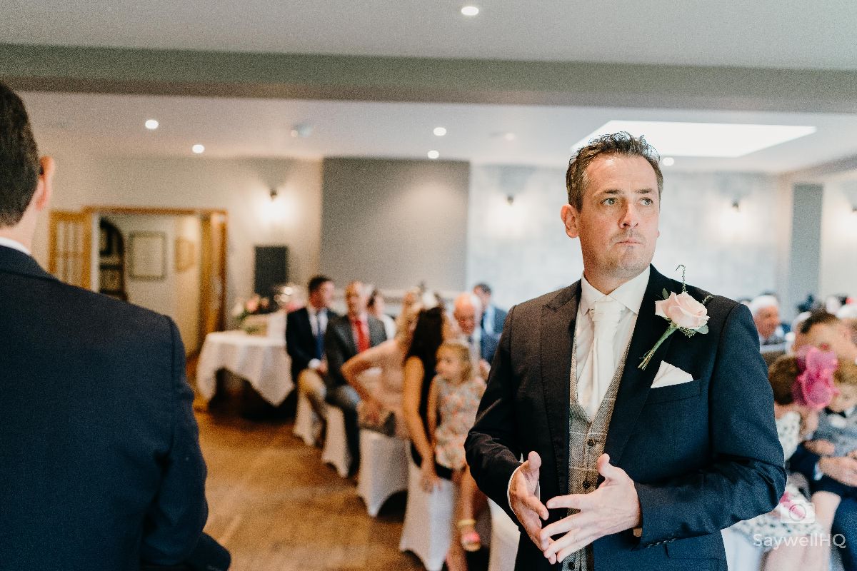 Chequers Inn Wedding Photography - Groom nervously waiting