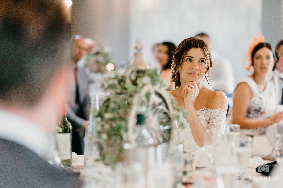 Chequers Inn Wedding Photography - Bride looking on during the wedding speeches