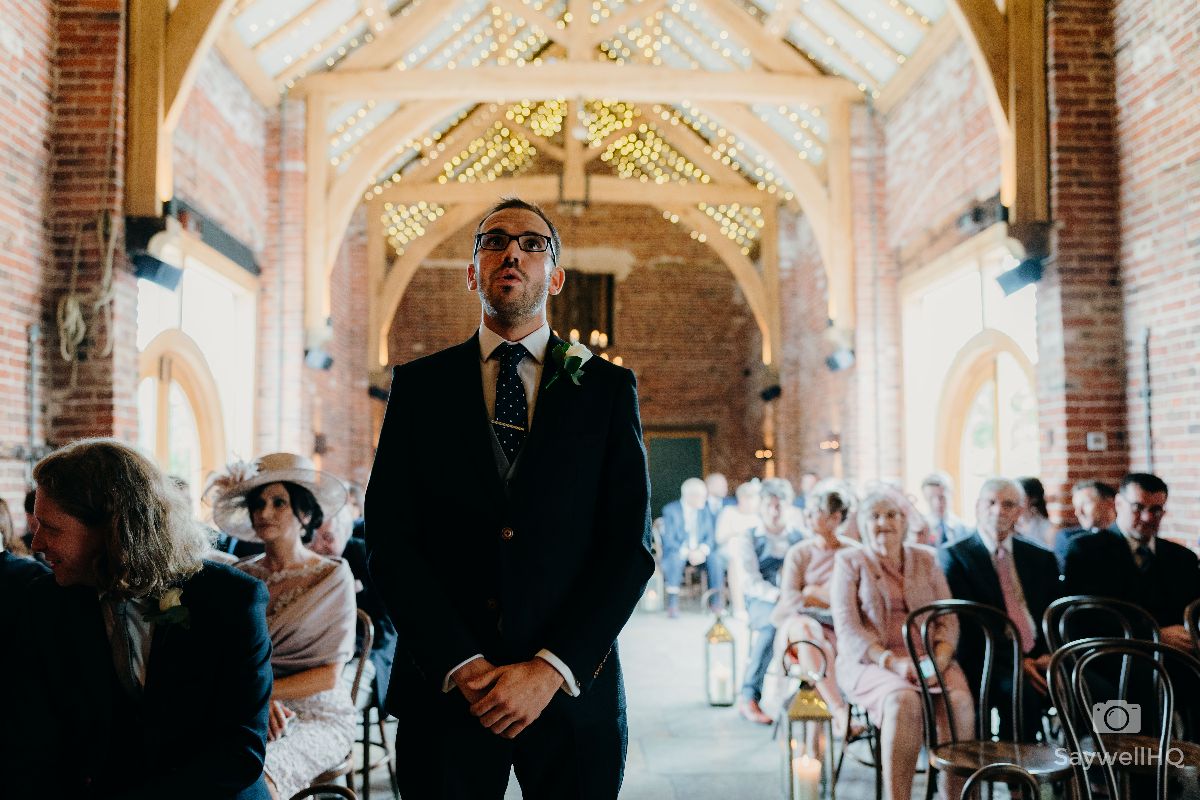 Hazel Gap Barn Wedding Photography - Groom looking nervous before the wedding ceremony