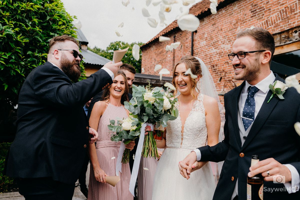 Hazel Gap Barn Wedding Photography - Bride and Groom get covered in Confetti!