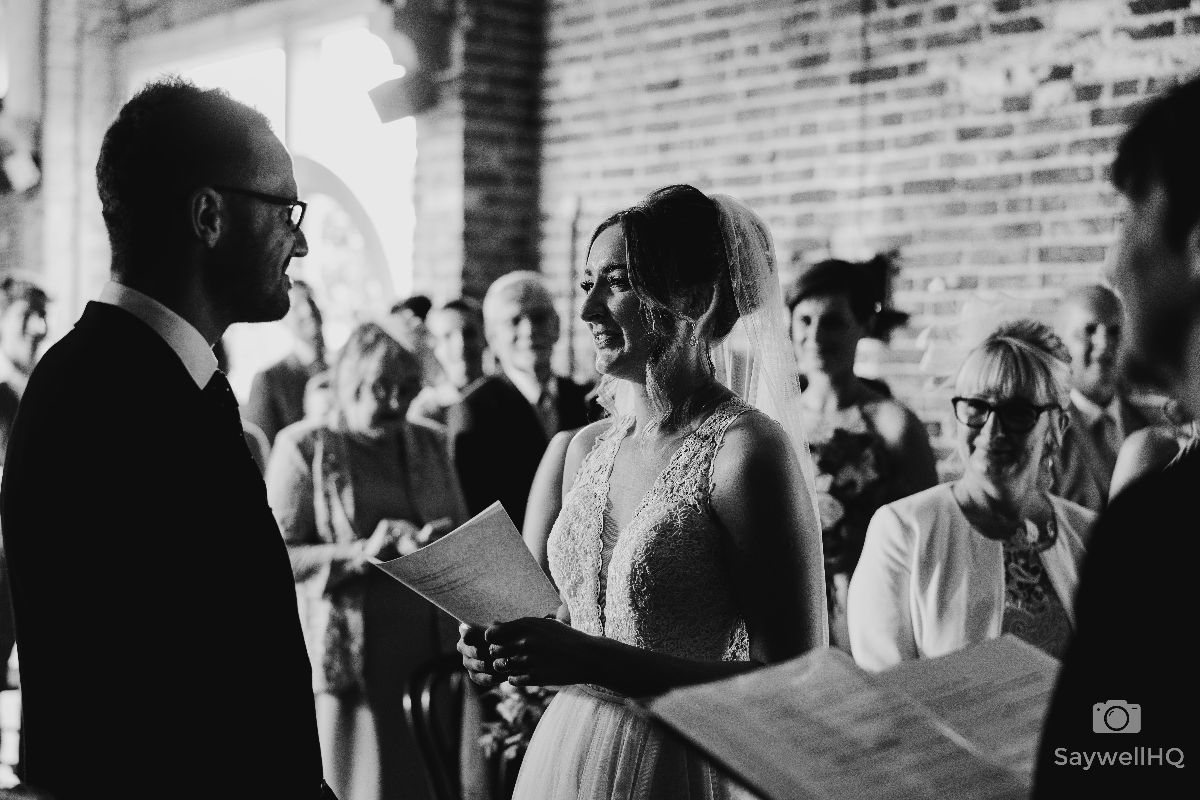 Hazel Gap Barn Wedding Photography - Bride and Groom exchange their wedding vows