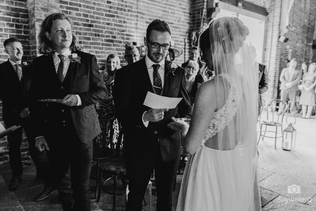 Hazel Gap Barn Wedding Photography - Bride and Groom exchange their wedding vows