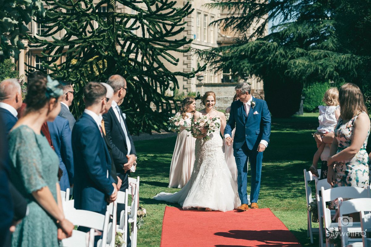 Prestwold Hall Wedding Photography - Bride and her Father walking down the Aisle