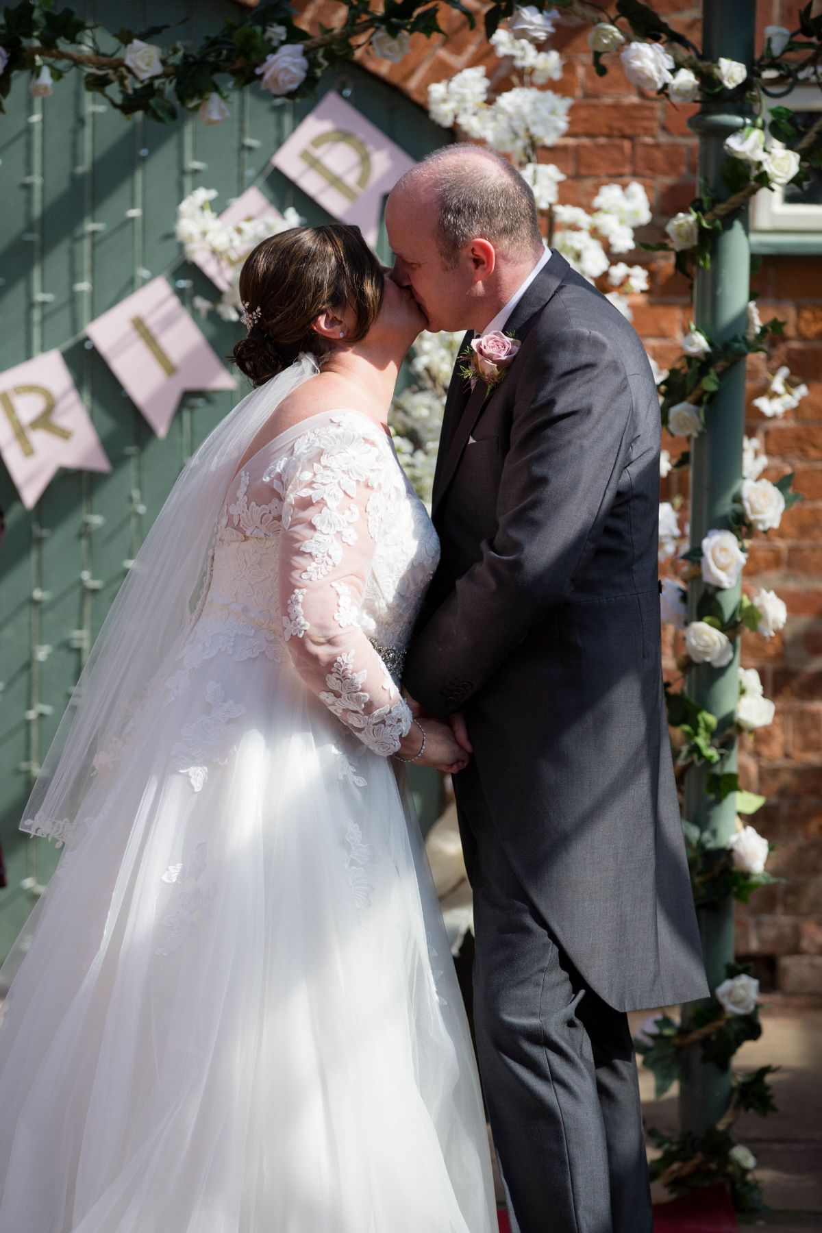 Sealed with a Kiss in a courtyard ceremony.  