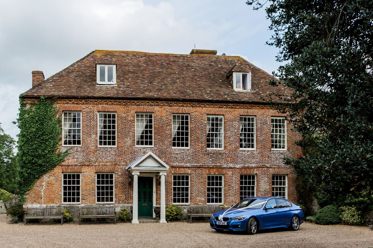 The groom's car outside the house