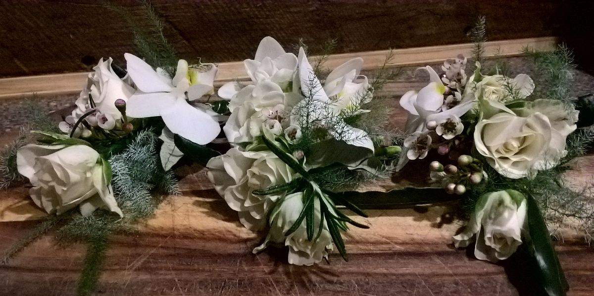 Corsages for Mums - tiny white orchids and roses