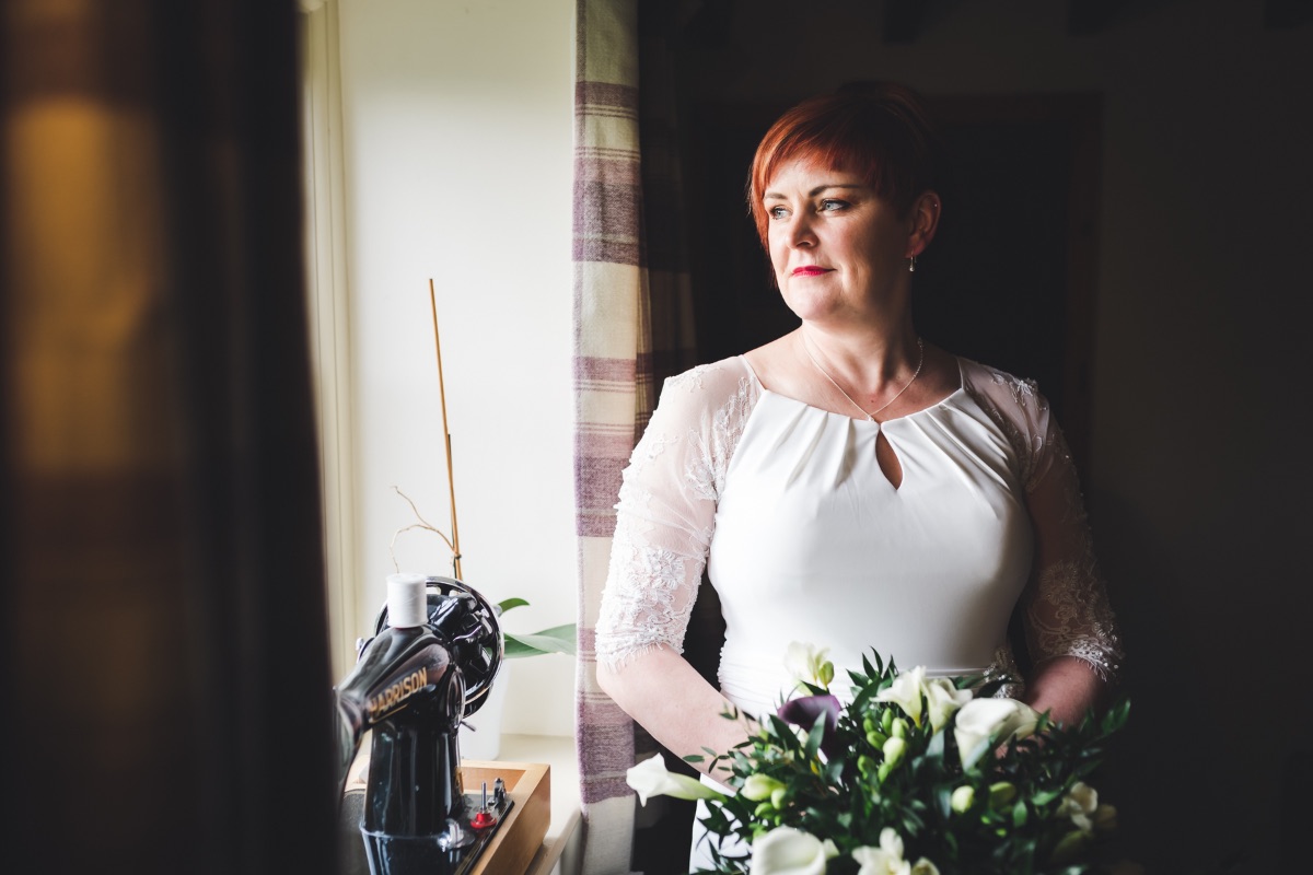 I love to photograph my brides by a window, its the beauty of light and shadow