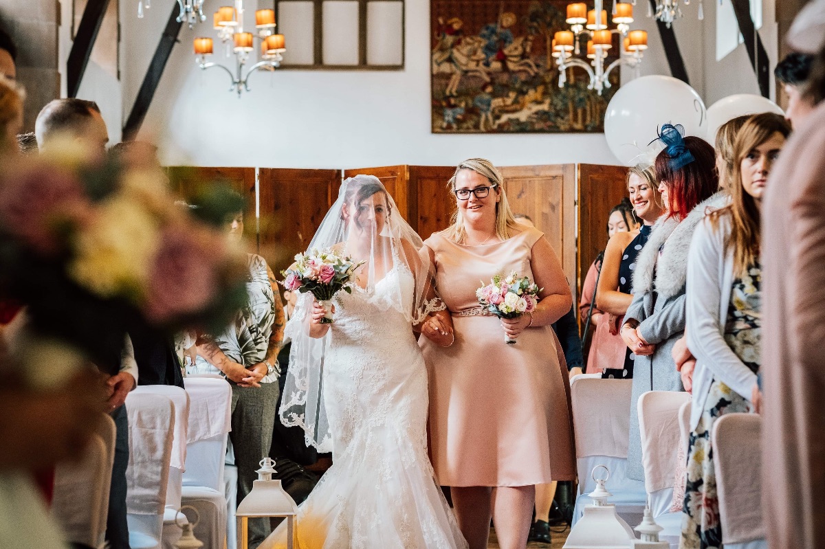 Katie and her maid of honour giving her away