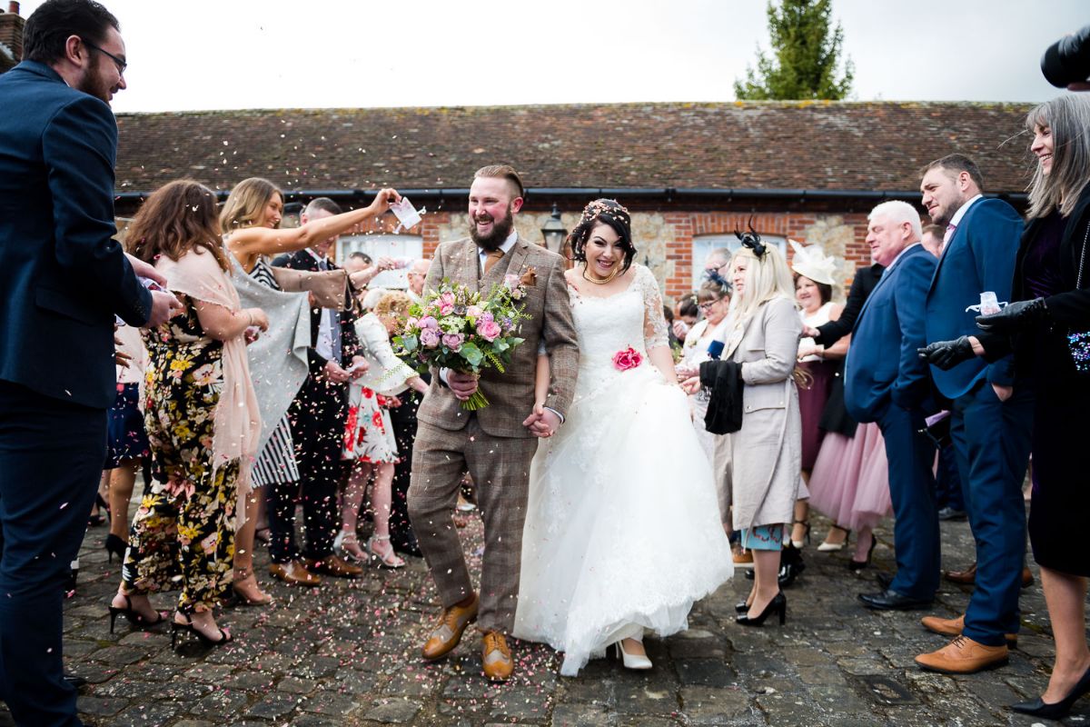 A great confetti line outside the coach house at The Secret Gardens in Ashford