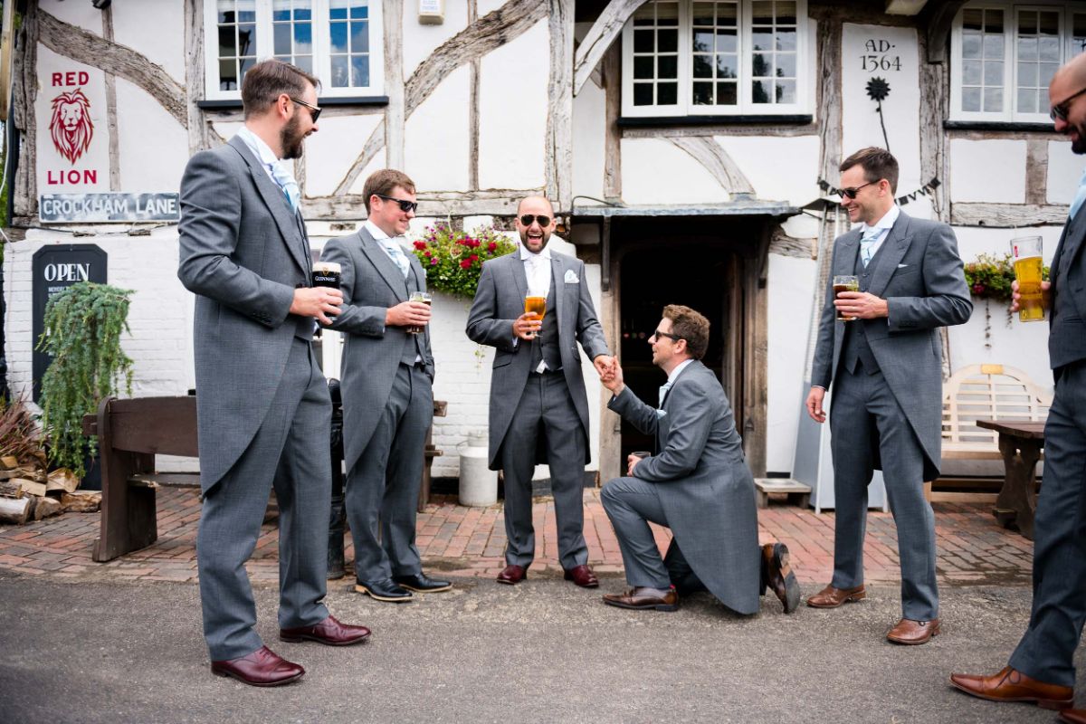 groom and ushers enjoy a drink at the pub before the ceremony at The Mount Ephraim Gardens