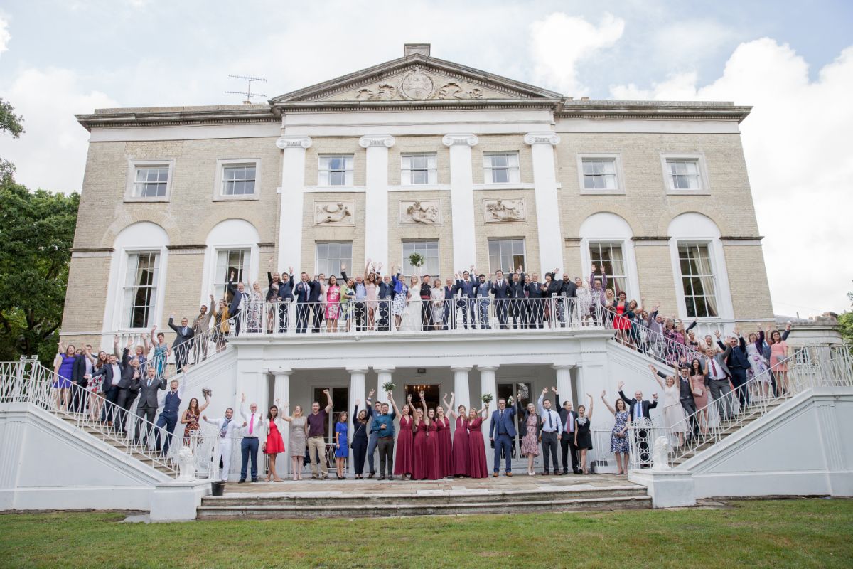 Back Drop of Castle Goring with wedding party.