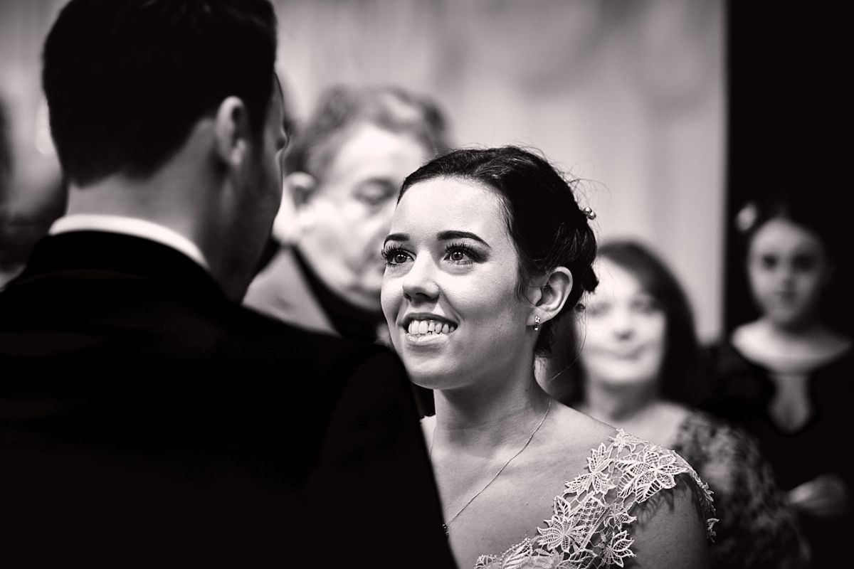 The blushing bride at the ceremony.