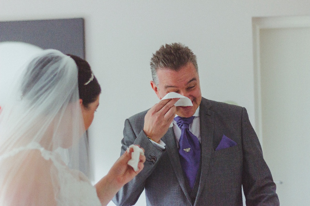 Bride's father seeing her in her wedding dress for the first time.