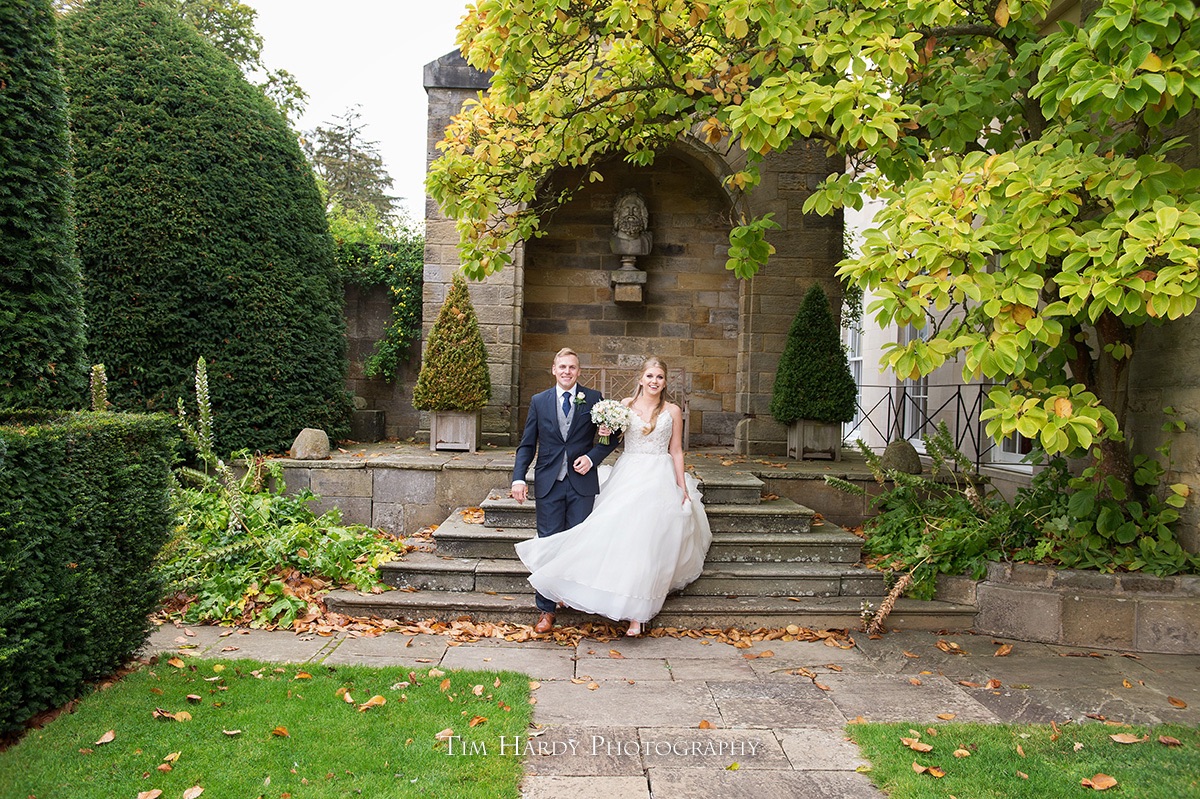 Bride and groom on the terrace steps at Rudding Park